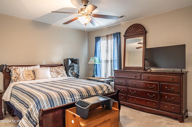 bedroom featuring ceiling fan and light colored carpet