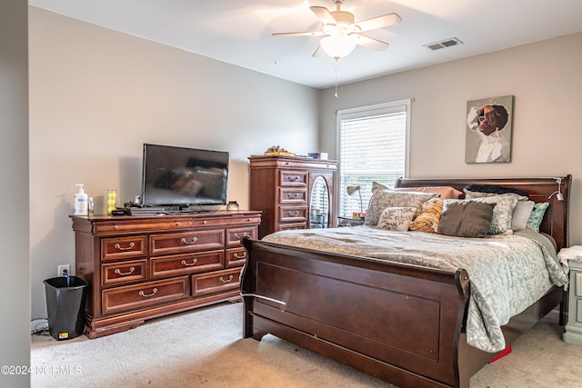 bedroom featuring ceiling fan and light carpet