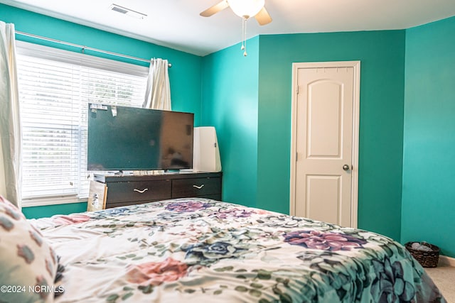 bedroom featuring ceiling fan and carpet floors