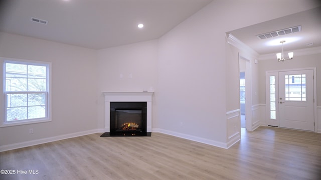 1254 Opaca Dr SE, Bolivia, NC 28422 - unfurnished living room featuring light wood-style floors, a chandelier, baseboards, recessed lighting, and ornamental molding