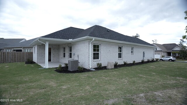 1254 Opaca Dr SE, Bolivia, NC 28422 - rear view of house with a patio, roof with shingles, and brick siding