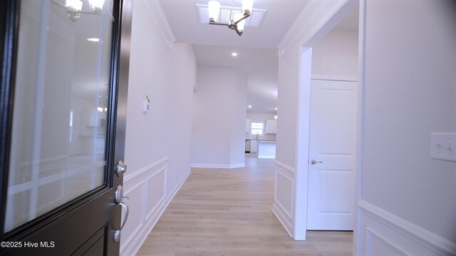 1254 Opaca Dr SE, Bolivia, NC 28422 - unfurnished living room with a chandelier, a glass covered fireplace, light wood-style flooring, baseboards, and recessed lighting