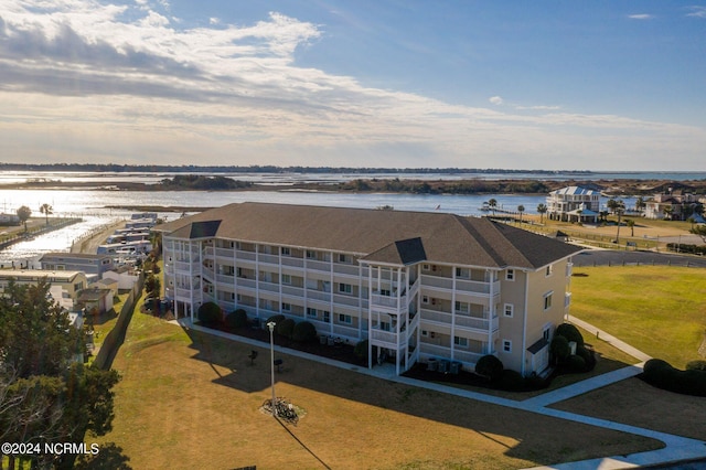 birds eye view of property with a water view