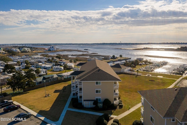 birds eye view of property with a water view