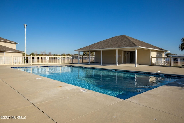 view of swimming pool with a patio area