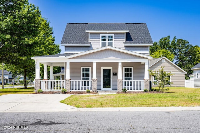 craftsman-style home with a front yard