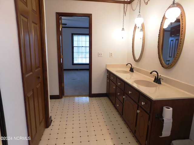 bathroom with dual vanity and tile floors