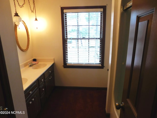 bathroom with dual sinks and oversized vanity