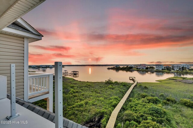 705 New River Inlet Rd, North Topsail Beach, NC 28460 - back of house featuring roof with shingles, a water view, and a balcony