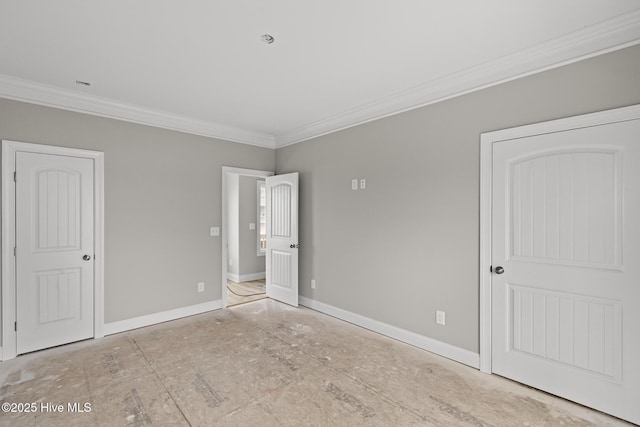 unfurnished bedroom featuring ornamental molding and baseboards