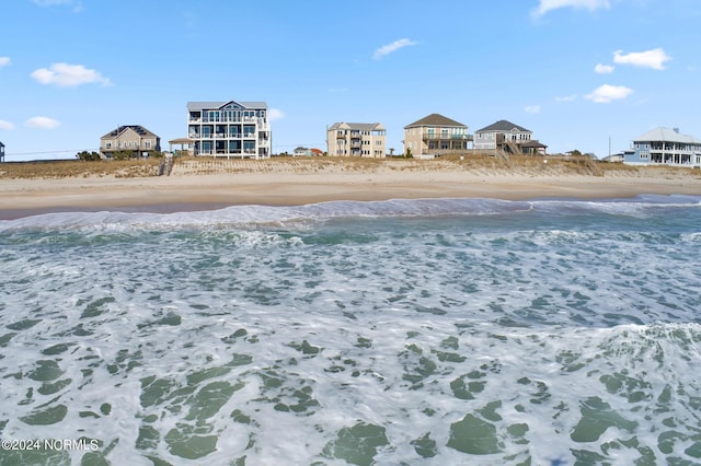 view of water feature with a beach view