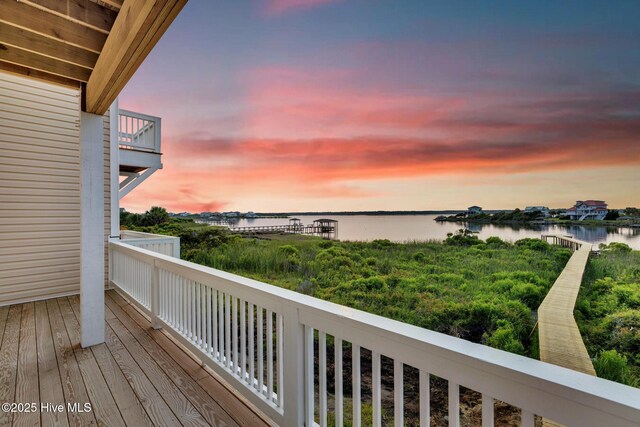 705 New River Inlet Rd, North Topsail Beach, NC 28460 - back of property with a balcony and view of water and beach