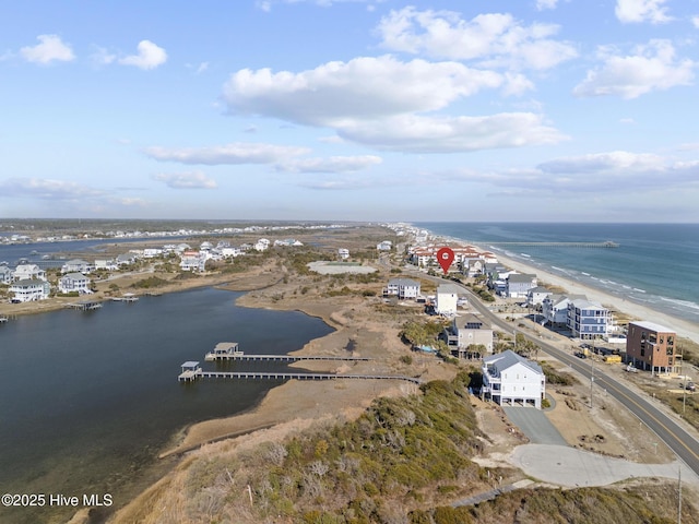 aerial view with a beach view and a water view