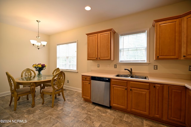 kitchen featuring sink, stainless steel dishwasher, a chandelier, and decorative light fixtures