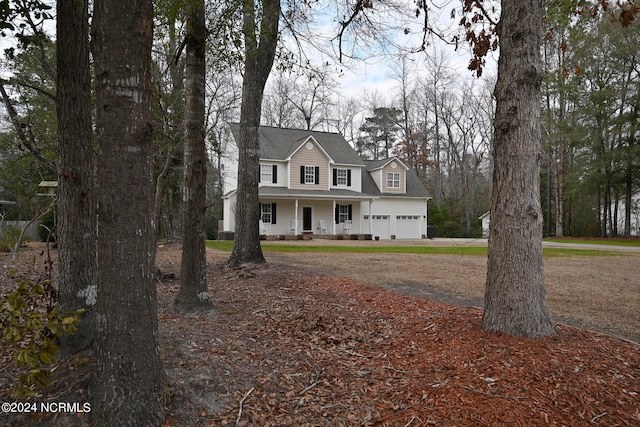 view of front of property with a garage and covered porch