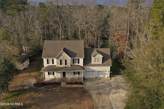 view of front of property with a garage and covered porch