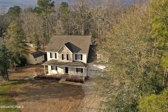 view of front of house featuring a garage and covered porch