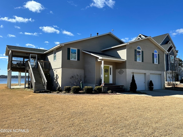 view of front of house featuring a wooden deck and a garage