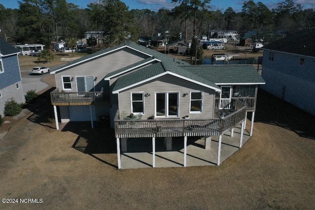 back of property with a pergola and a patio area