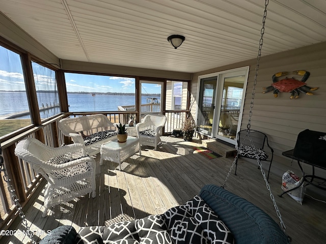 sunroom with a water view