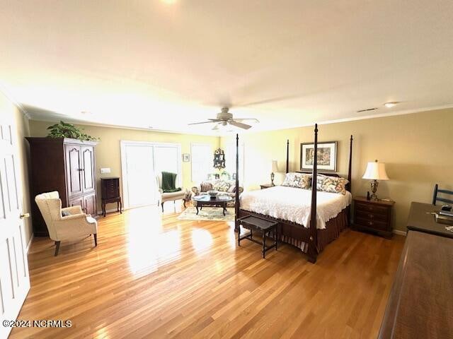 bedroom with ceiling fan and light hardwood / wood-style floors