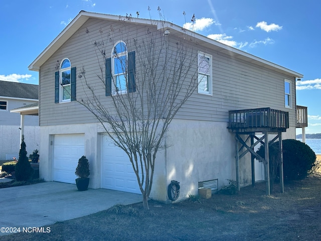 view of side of property featuring a garage