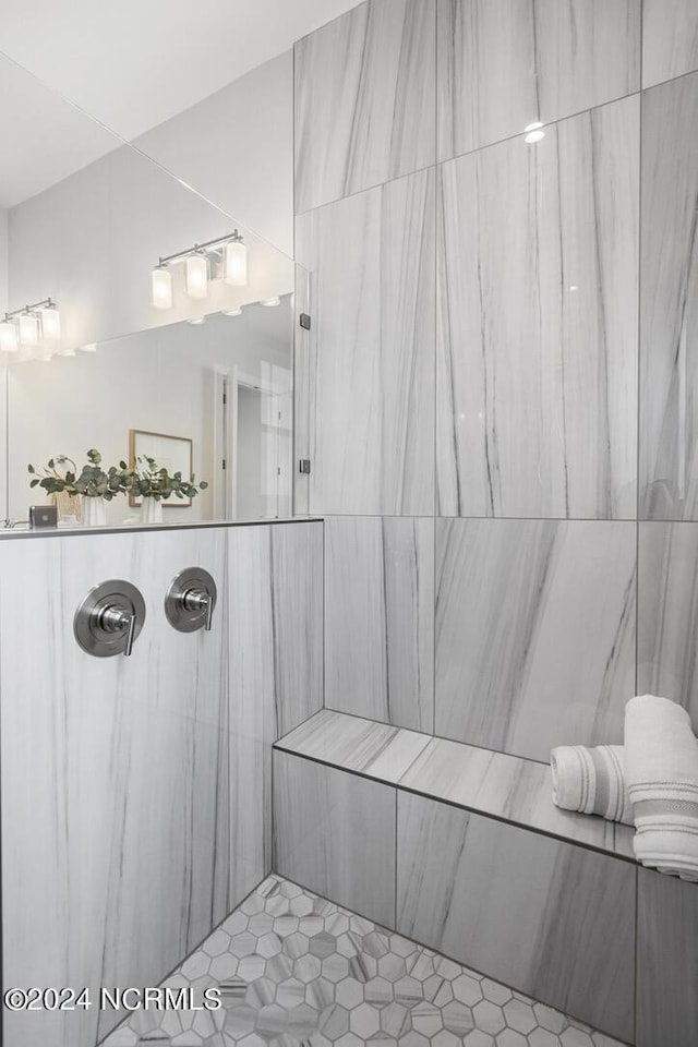 bathroom with tiled shower