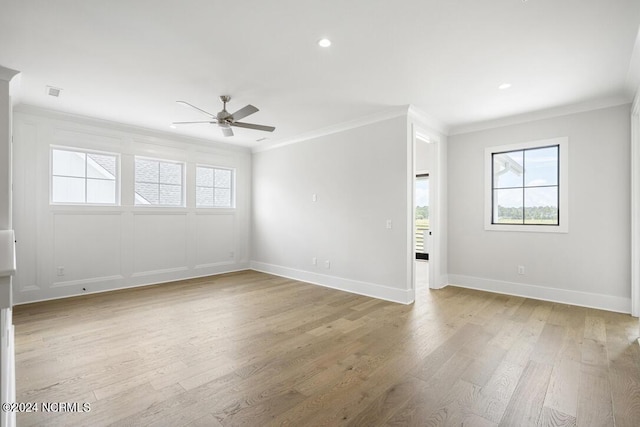 unfurnished room featuring ceiling fan, ornamental molding, and light hardwood / wood-style floors