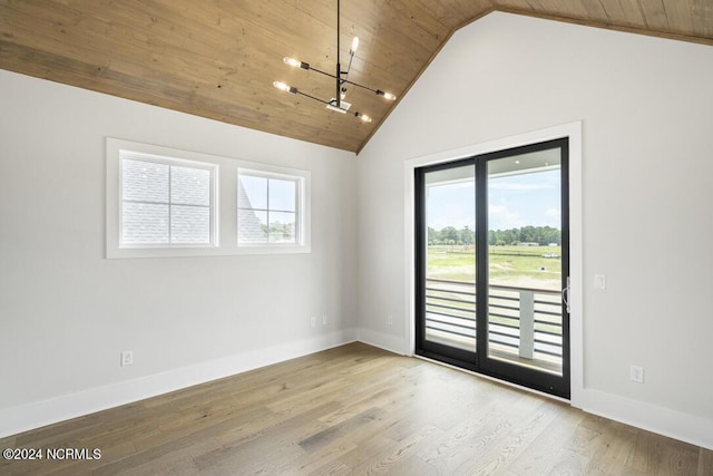 unfurnished room with light hardwood / wood-style floors, a wealth of natural light, and wood ceiling