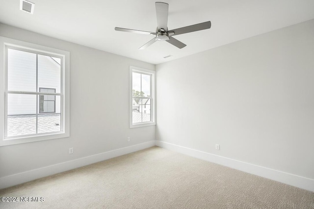 empty room with carpet floors and ceiling fan