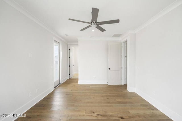 unfurnished room with ceiling fan, ornamental molding, and light hardwood / wood-style floors