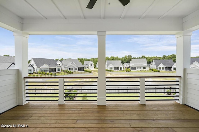 wooden deck featuring ceiling fan