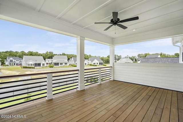 wooden terrace featuring ceiling fan