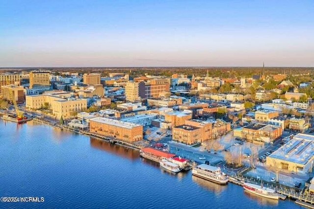 aerial view at dusk with a water view