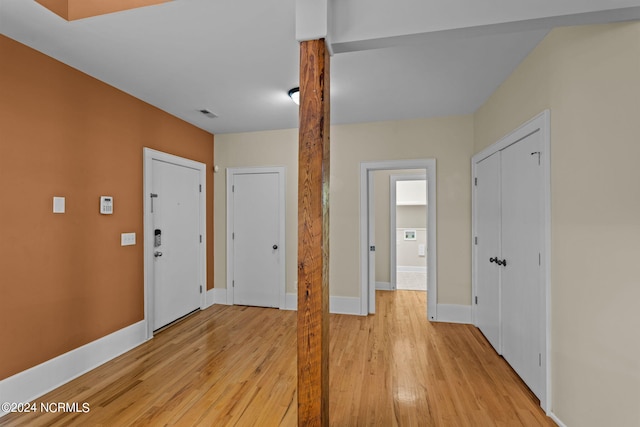 foyer entrance with light wood-type flooring