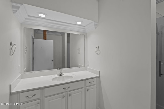 bathroom with vanity and ornamental molding