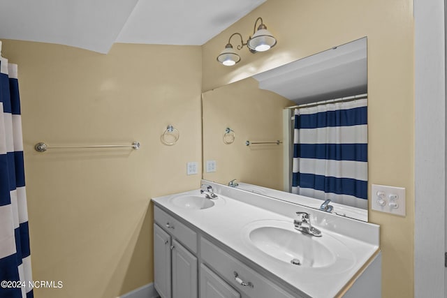 bathroom with vanity and curtained shower