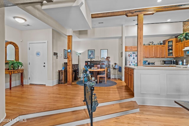 foyer entrance with light wood-type flooring