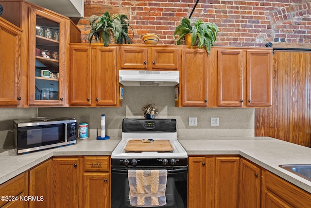 kitchen with backsplash and electric range