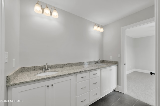 bathroom featuring double sink vanity and tile flooring