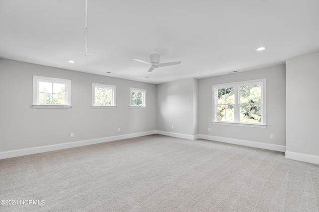 empty room with light carpet and ceiling fan