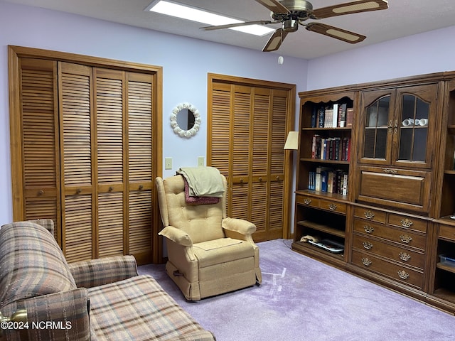 sitting room with light carpet and ceiling fan