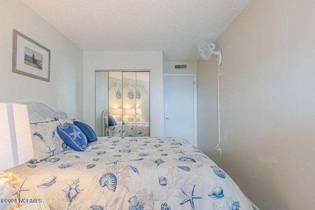 bedroom featuring a closet and a textured ceiling