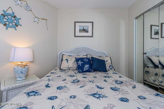 bedroom featuring a closet and a textured ceiling