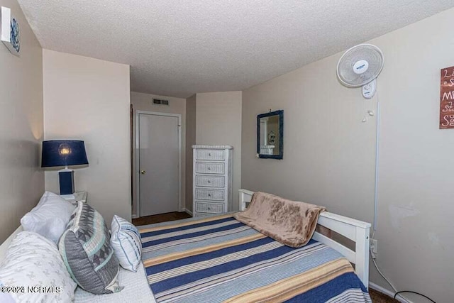 bedroom featuring a textured ceiling