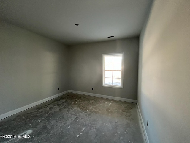 1204 Opaca Dr SE, Bolivia, NC 28422 - spare room featuring baseboards and unfinished concrete flooring