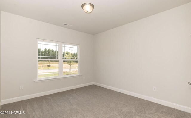 1204 Opaca Dr SE, Bolivia, NC 28422 - unfurnished room with carpet flooring and baseboards