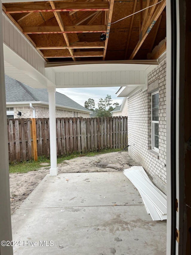 view of patio / terrace featuring fence