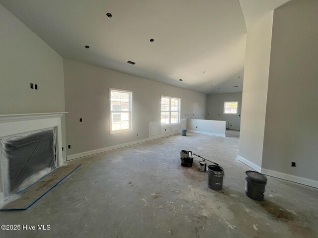 1204 Opaca Dr SE, Bolivia, NC 28422 - spare room with a raised ceiling, crown molding, baseboards, and concrete floors