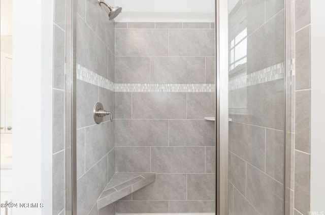 bathroom featuring a stall shower